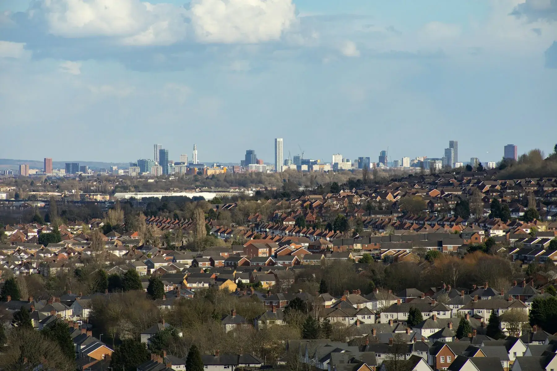 Birmingham skyline above residential rooftops