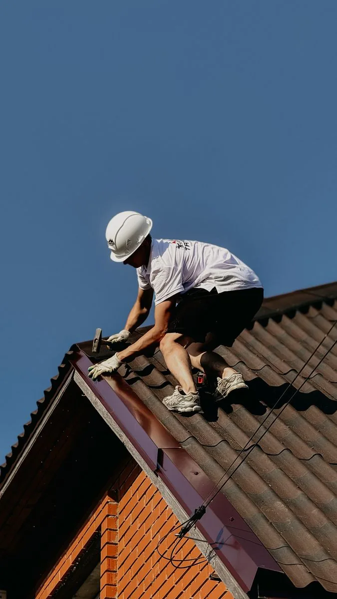 Roofer working on a tiled roof